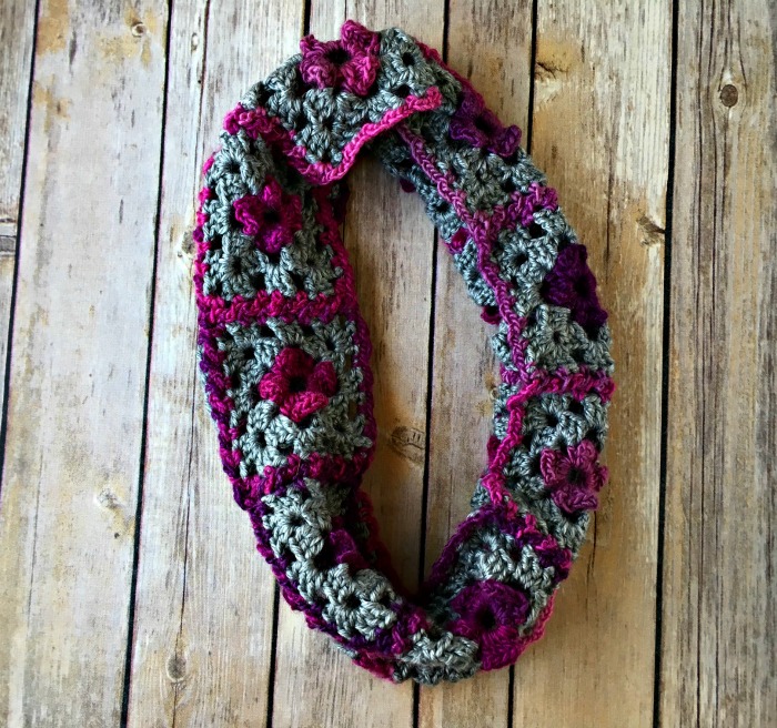 granny crochet cowl on wooden background