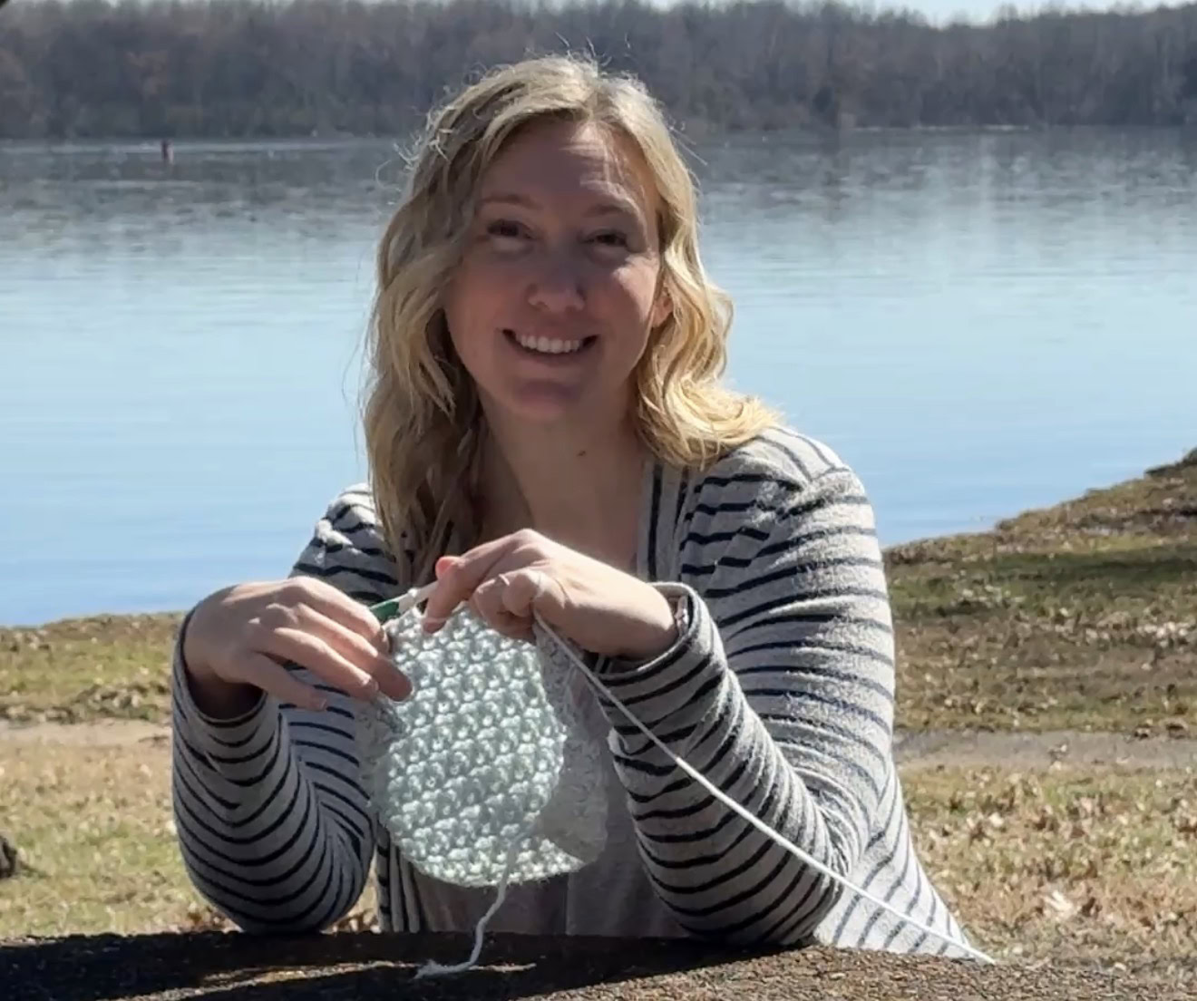 Amanda Saladin crocheting outside