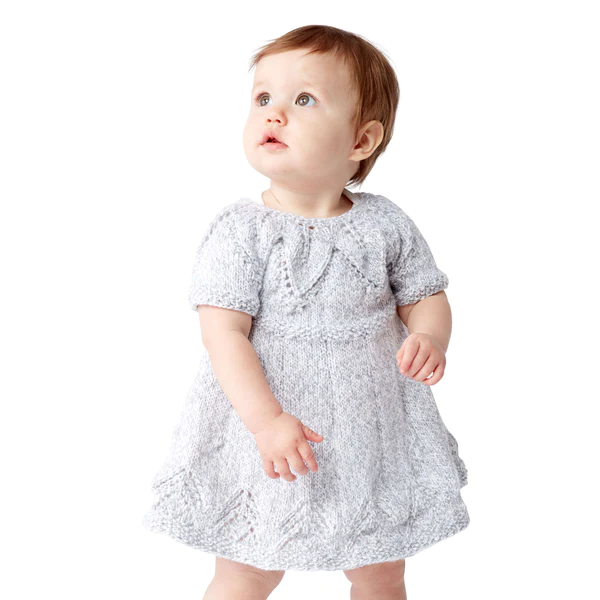 baby wearing a white fairy leaves dress