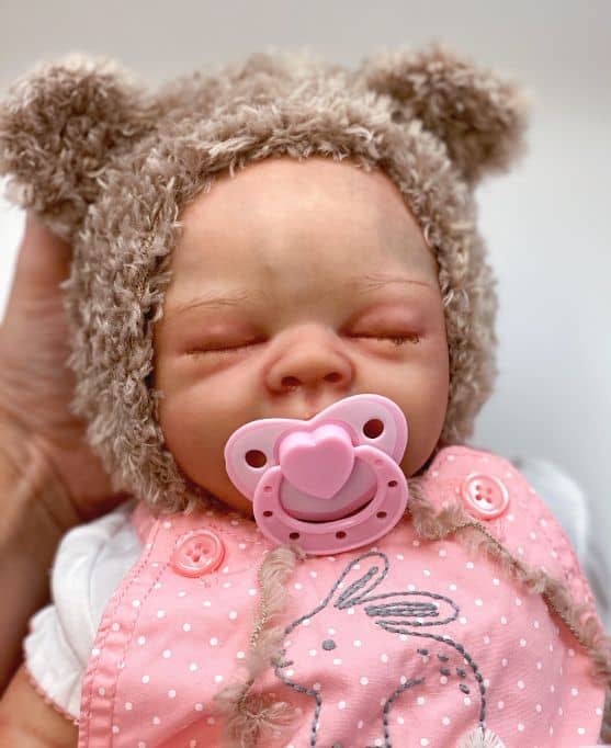 crochet baby hat with sleeping baby