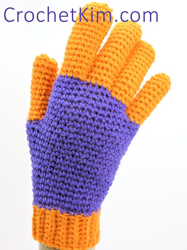 a hand wearing jersy gloves