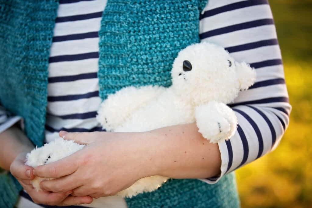 designer cradling knit polar bear