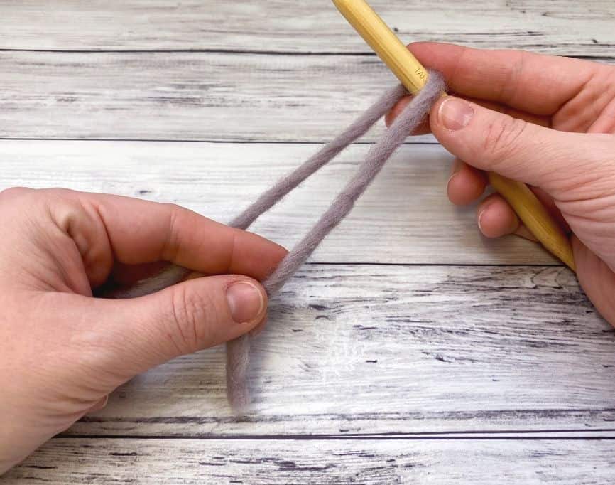 yarn looped over needle