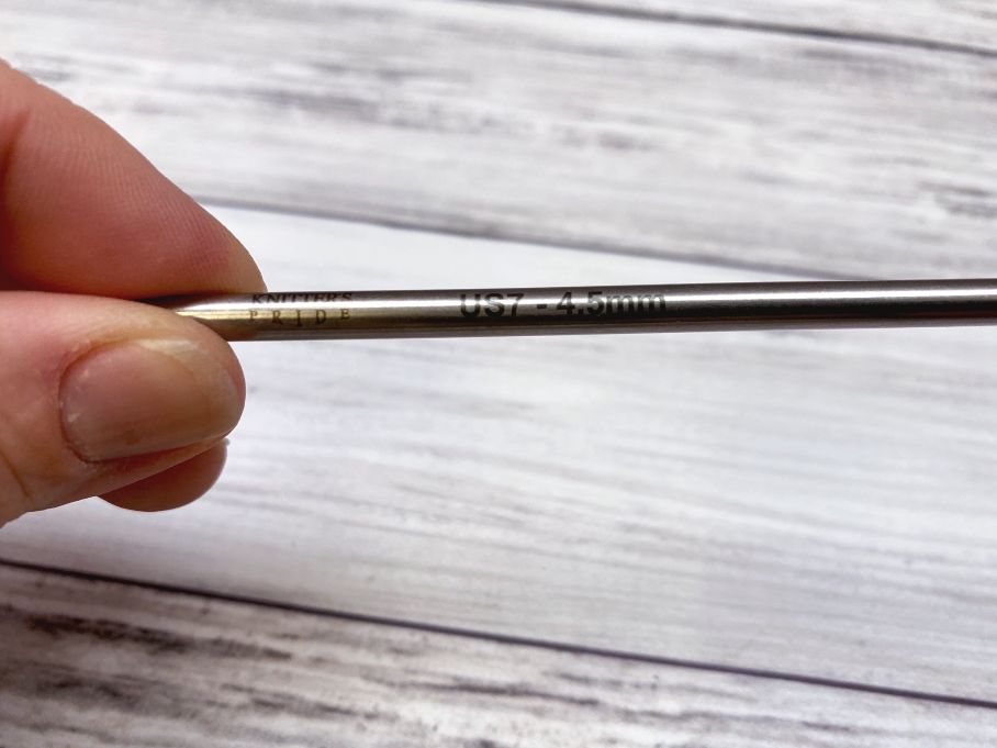 close up of size on knitting needle