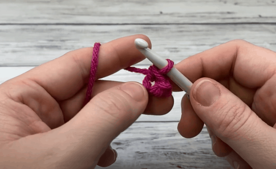 a hand doing  Single crochet in the second chain from the hook
