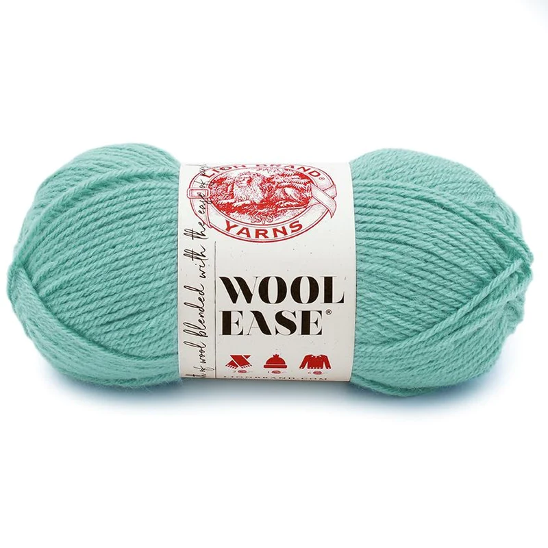 teal skein of wool ease on white background